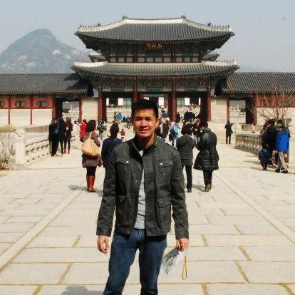 The author, posing gamely at a palace in Seoul, Korea